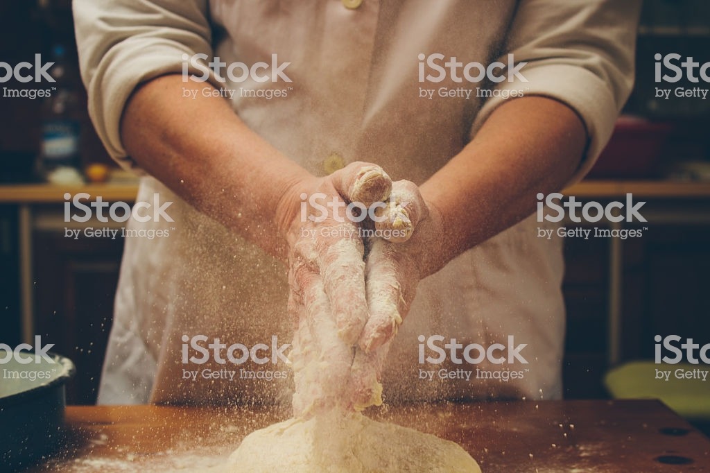 shaking baking powder on some bread